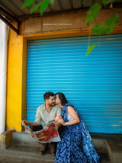 Capturing the simple joy of sharing a moment together. This urban photoshoot uses a bold, colorful backdrop to highlight the couple's connection.