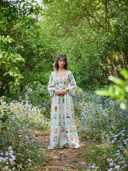 A frontal view of the model in the garden setting. The overall effect is dreamy and ethereal, showcasing my ability to create a strong thematic campaign.
