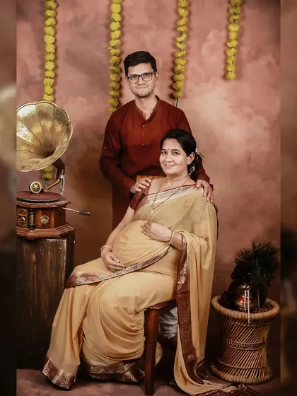 Including your partner in the maternity photoshoot adds another layer of love and connection to the portraits. Here's a beautiful moment from a traditional themed session.