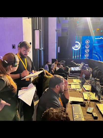 A team discussion at the console during the TransUnion CIBIL event. We work collaboratively to solve problems in real-time.