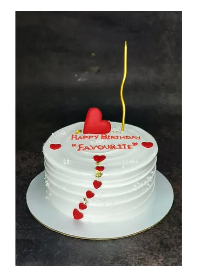 A sweet and simple cake for a "favourite" person. This mixed fruit cocktail cake is decorated with a cascade of fondant hearts.