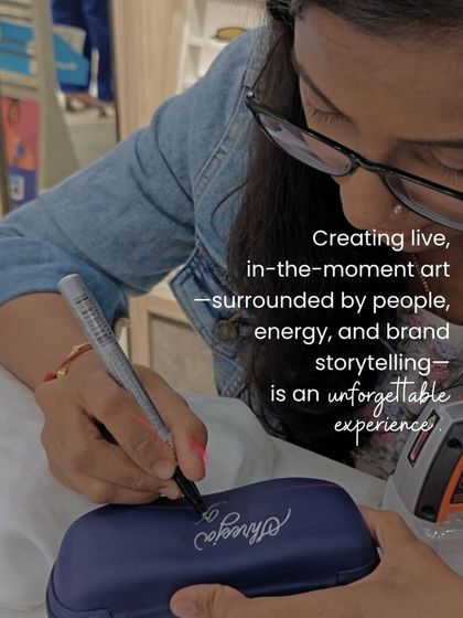 Creating art live, surrounded by the buzz of a brand event, is an unforgettable experience. Here I am, personalizing a Lenskart sunglass case for a customer.