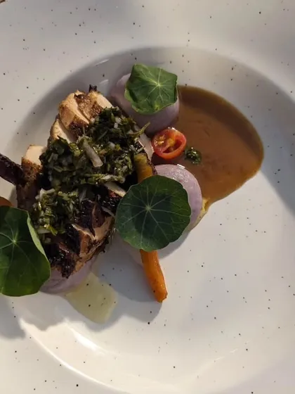 We believe in letting quality ingredients shine. This dish features roasted chicken with a vibrant flat-leaf parsley chimichurri, paired with seasonal organic vegetables sourced directly from our partner farms.