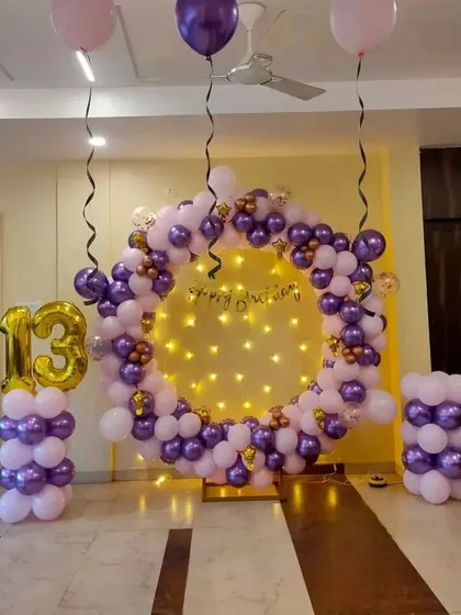 A full view of the 13th birthday ring setup in the party space.