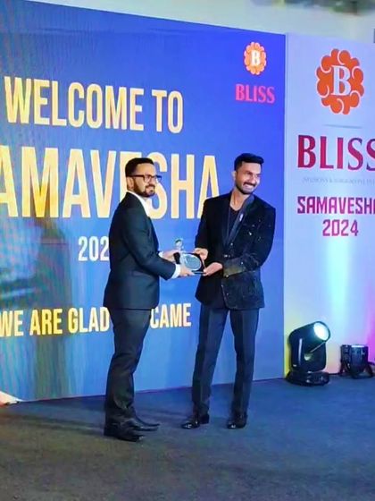 Receiving a token of appreciation from the Bliss leadership team. It was an honor to be part of their 'Samavesha 2024' event.