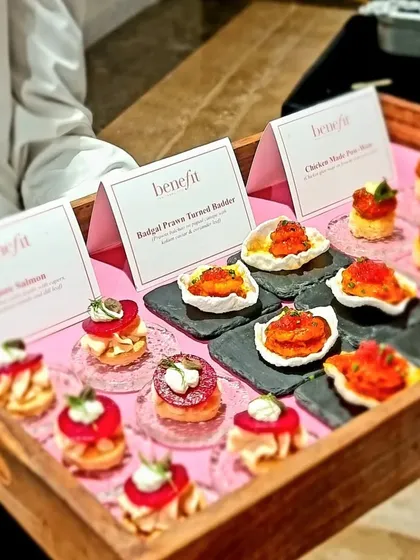 A serving tray showcasing the variety of pink-themed appetizers for the Benefit Cosmetics event. We design our menus to be a core part of the brand story you want to tell.