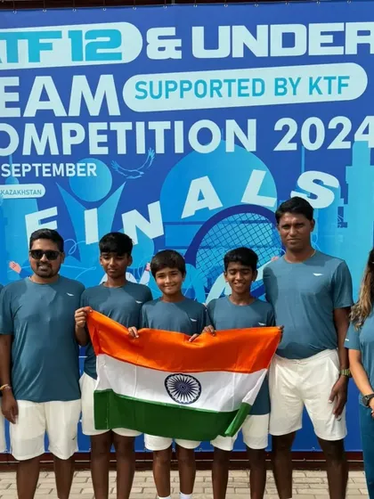 The boys' U-12 team and coaches posing with the Indian flag. It's an honor to have our players reach this level.