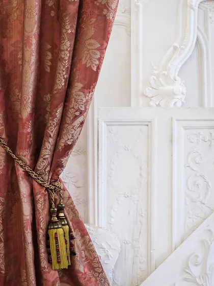 The 'Foscarini' drapery by Nobilis Paris weaves timeless charm with its delicate floral pattern on a sophisticated strié warp. This classic damask fabric, shown here as a luxurious curtain, is available in five elegant colorways.