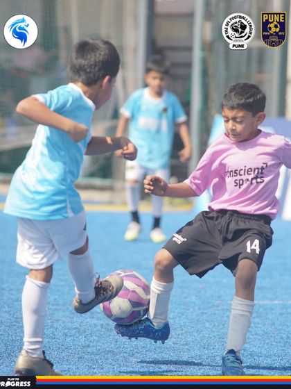 A clash on the blue turf in Pune. The vibrant colors match the energy of the players.