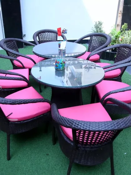 Comfortable outdoor seating for guests to relax and enjoy the party atmosphere on our green turf.