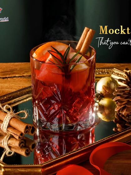 A mocktail you can't resist, perfect for the holiday season. This drink, rich with cinnamon and orange, offers a warm and festive non-alcoholic option for your guests.