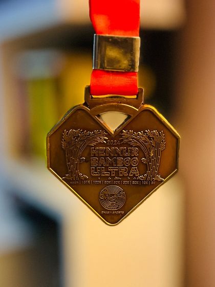 The beautifully designed finisher medal for the Hennur Bamboo Ultra. It’s more than just a piece of metal; it’s a symbol of the spiritual and physical journey of an ultra runner.