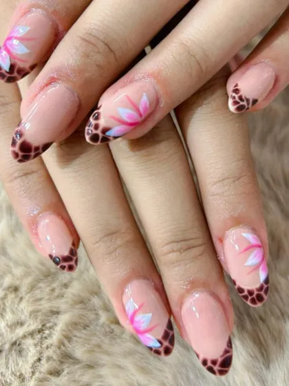 A unique combination of a tortoise shell French tip and delicate, hand-painted lotus flowers.