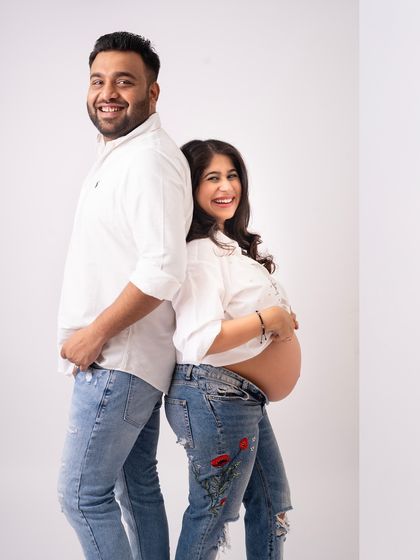 A fun, casual pose that shows your personality as a couple. Maternity shoots don't have to be all serious. Laughter and lightheartedness make for beautiful, genuine memories.