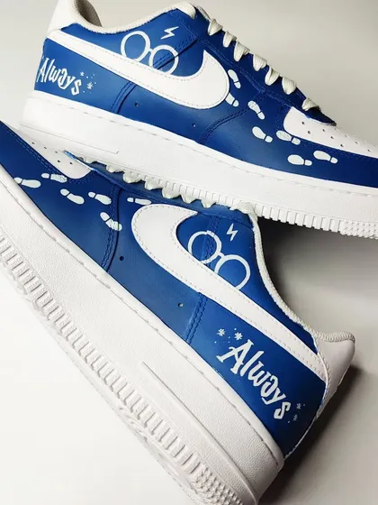 The other side of the Harry Potter AF1s is more minimal, with the iconic glasses, scar, and the word "Always" as a tribute to Snape. The Marauder's Map footprints add a magical touch.