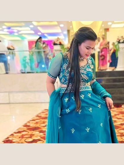 Our client looks graceful in this teal blue lehenga. The unique color and mirror work make it a memorable outfit for any special occasion.