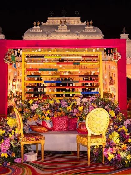 A vibrant Mehendi ceremony at Shiv Niwas Palace. I blend traditional festivities with sophisticated design, using rich florals and a bold color palette to create a joyful and visually stunning atmosphere against a heritage backdrop.
