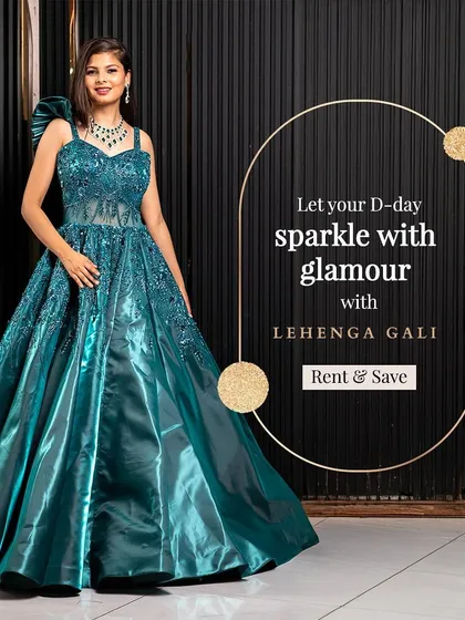 Let your D-day sparkle with this teal green sequined ball gown. The structured bodice and dramatic shoulder detail make it a high-fashion choice for a sangeet or cocktail night.