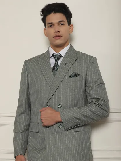 A classic grey pinstripe double-breasted suit, tailored by our craftsmen to fit your body and match your personality.