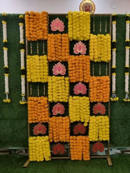 Another angle of the beautiful marigold backdrop for a Half Saree ceremony.