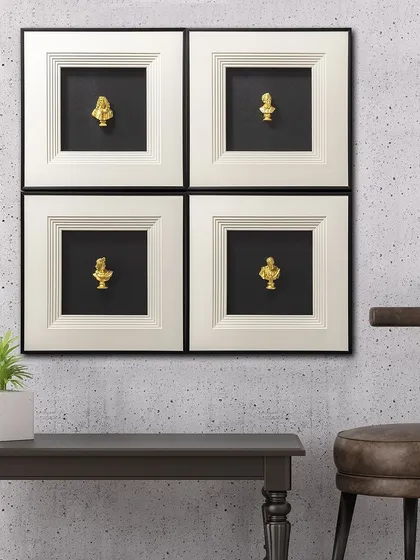 A set of four shadow boxes, each featuring a small golden bust of a Greek god. The classic black and white framing makes this a sophisticated and timeless addition to a study or library.