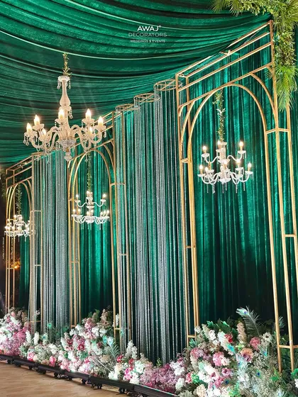 A side view of the walkway, showcasing the repetition of the arches and chandeliers that create a sense of grandeur.
