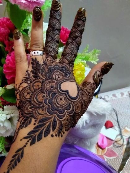 A gorgeous design with a heart-shaped negative space in the center, surrounded by intricate patterns.