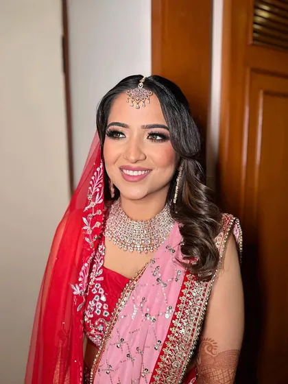 A radiant smile from a happy bride. Prachi's makeup was designed to enhance her natural beauty and keep her glowing throughout the ceremony.