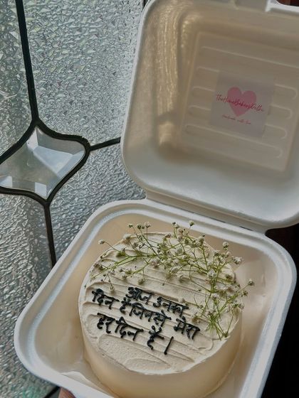 A beautiful bento cake with a message in Hindi and delicate baby's breath flowers. We love incorporating different languages and personal touches into our designs.