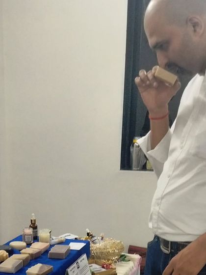 A customer taking a moment to smell one of my naturally scented soaps.