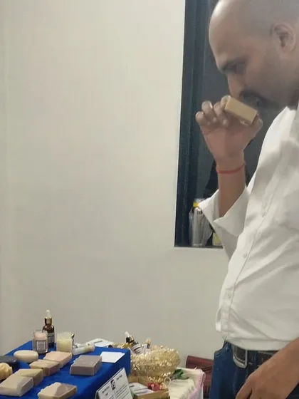 A customer taking a moment to smell one of my naturally scented soaps.