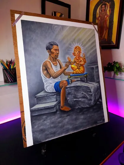 Another angle of the completed Ganesh Ji painting, showing the depth and emotion of an artist creating his art.