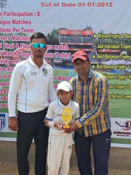 Abhay Dahiya receiving his Man of the Match award at a junior tournament.