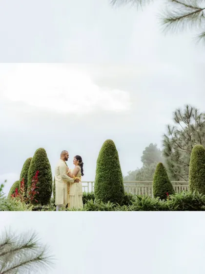 A wide shot of the couple's Haldi ceremony in Solan, capturing the lush greenery and mountain mist that made their destination wedding so special.