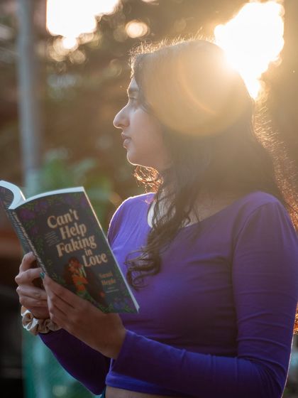 Reading my second novel, "Can't Help Faking in Love," with the golden hour glow. This book is like "The Kiss Quotient" meets "Anyone But You."