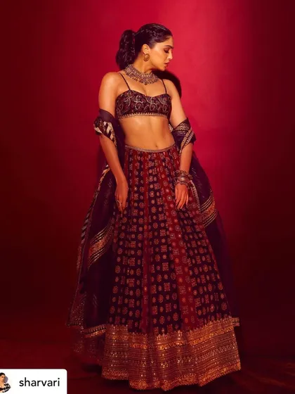A full-length shot showcasing Sharvari's complete look. The makeup was balanced to work with the detailed embroidery of her lehenga, creating a cohesive and stunning appearance.