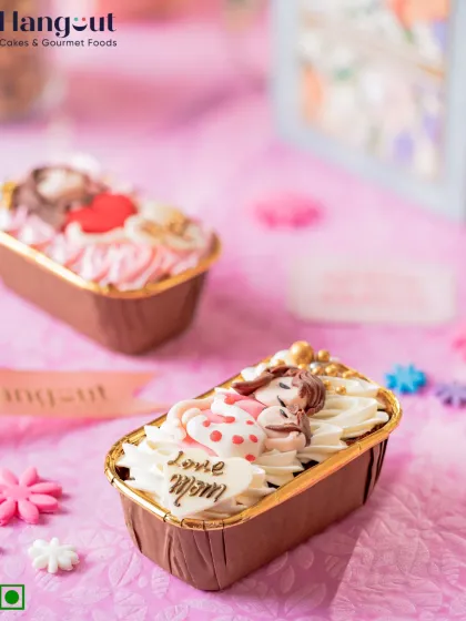 Our Orange Chocolate Glazed Bar Cake is a sweet reminder of love. Topped with a fondant figurine, it's a beautiful and delicious individual treat for Mother's Day.