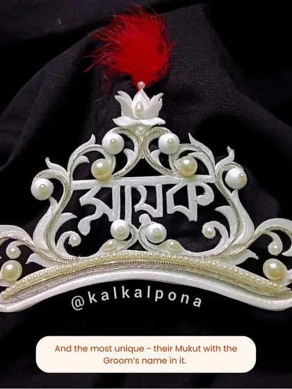 Another example of a personalized groom's topor, with the name 'Mayukh' beautifully integrated into the design. It's a detail that makes the tradition feel uniquely yours.