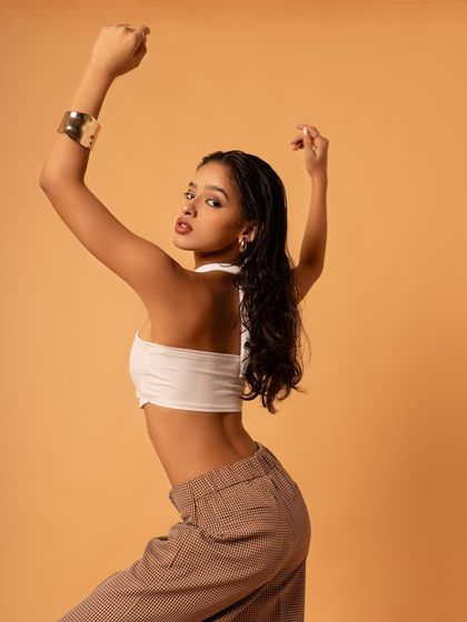 The color version of a strong, upward-reaching pose. This shot feels full of energy and aspiration, reflecting my journey as a dancer.