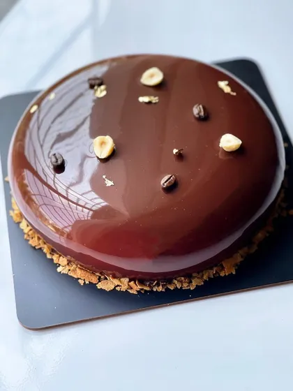 A top-down view of the stunning Coffee Hazelnut entremet.