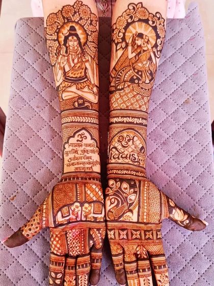 A spiritual and intricate bridal design featuring Lord Shiva in meditation on one arm and the divine couple Shiva and Parvati on the other. The design also includes sacred mantras and the "Shubh Vivah" blessing.
