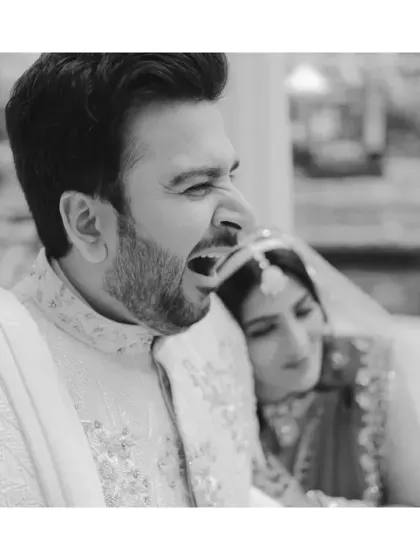 Real is where the story lives. The groom caught in a mid-yawn during a portrait session is not an imperfection, it's a reflection of their goofy, fun vibe. Monochrome makes this real moment feel timeless.