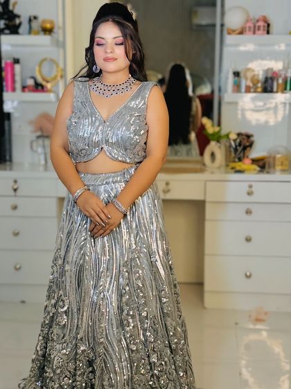 A full-length shot of the silver sequin lehenga, showing its flattering silhouette.