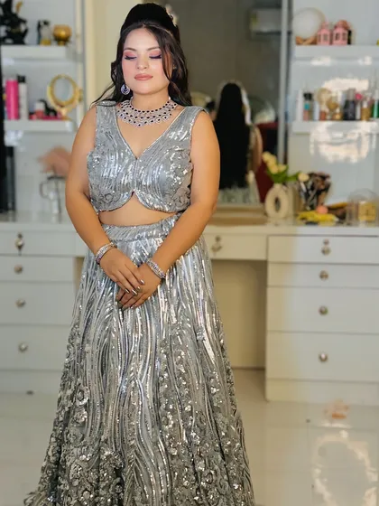 A full-length shot of the silver sequin lehenga, showing its flattering silhouette.