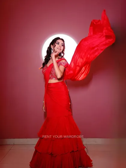 A dynamic shot with the saree's pallu in motion, creating a beautiful, flowing effect.