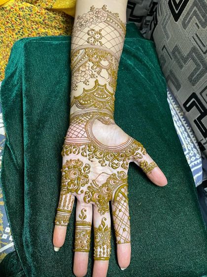 This is what a design looks like before all the filling is complete. You can see the outline of the floral and geometric patterns, showing the blueprint of the final piece.