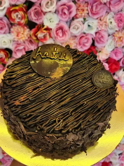For the ultimate indulgence, try my exclusive Brownie Cake. It combines the fudgy texture of a brownie with the structure of a cake, all covered in rich chocolate piping and shavings. It's a truly decadent treat.