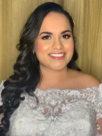 A beautiful portrait of Nimita, showcasing her radiant smile and the classic bridal makeup for her church ceremony.