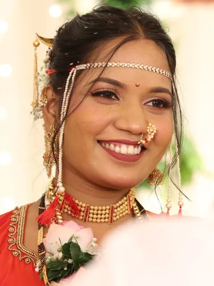 The classic red Nauvari look is a symbol of Maharashtrian tradition. I specialize in creating this iconic bridal style, complete with a radiant makeup finish, traditional jewellery, and a perfectly draped saree.