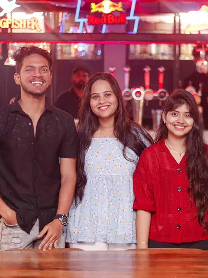 Smiles all around. We are the perfect spot to gather your friends for a night of drinks, conversation, and great music under our signature neon lights.